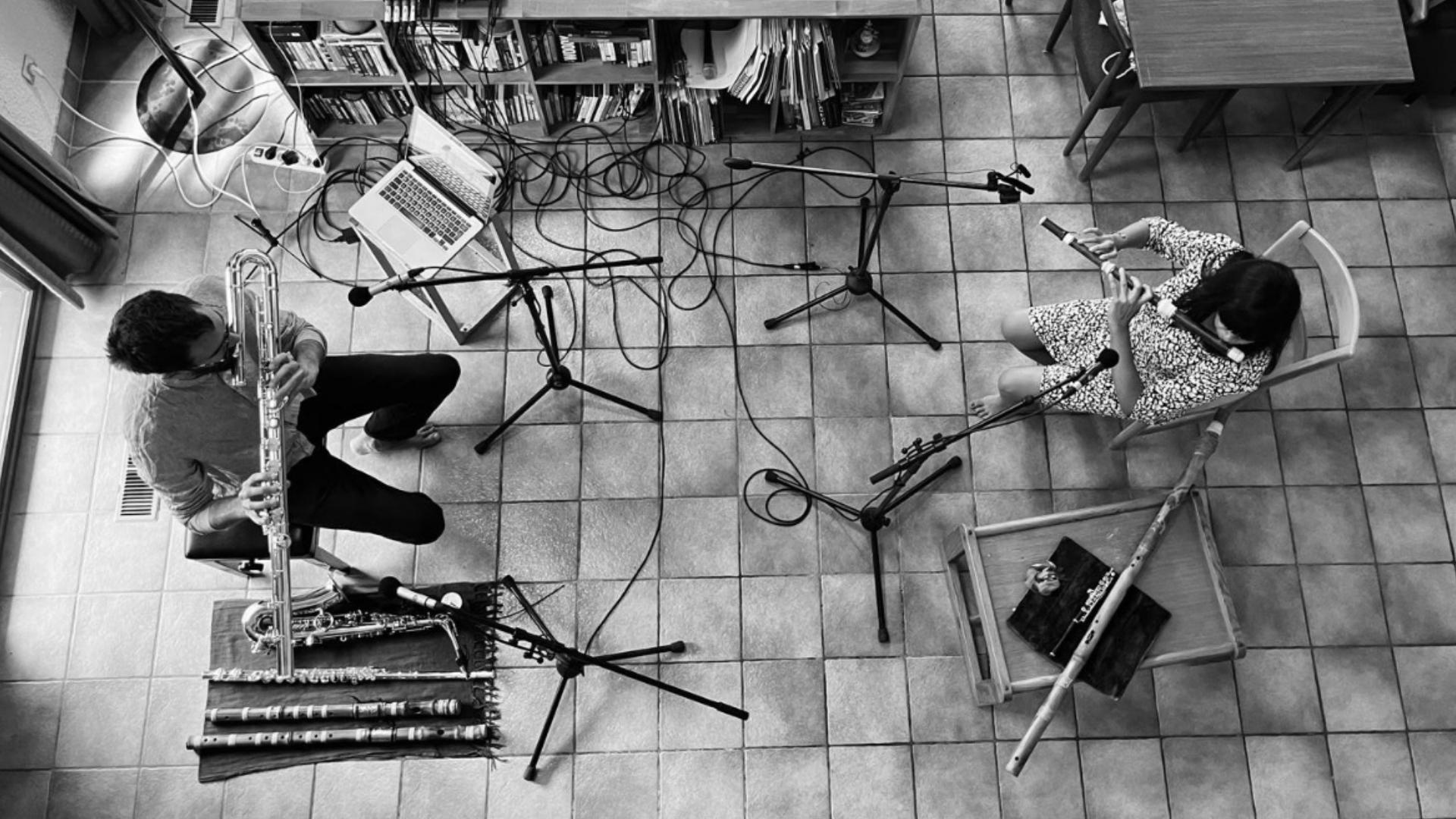 Violeta Motta and Sylvain Monchoce playing the flute during a recording session